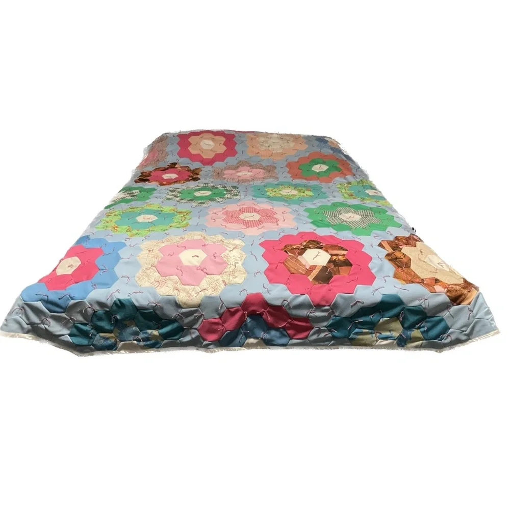 Hand Tied grandma’s flower garden quilt sewn by machine polyester fabric